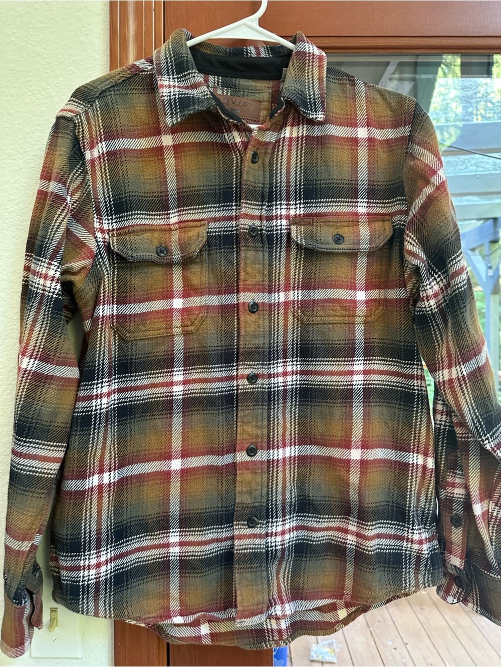 Orvis Plaid Flannel Shirt Jacket with lined pockets.